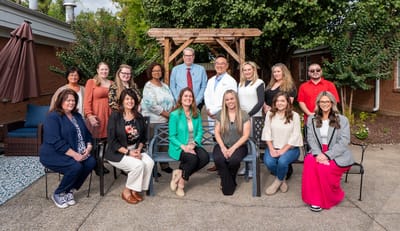 Group photo of staff members in an outdoor space