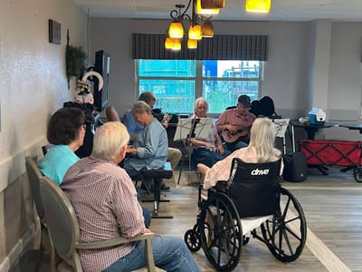 Residents enjoying a musical activity in a common area
