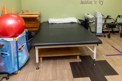 Therapy exercise area with equipment and therapy table