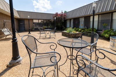 Outdoor patio area with seating and plants