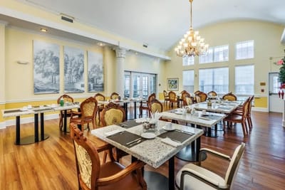 Elegant dining area with tables set for a meal