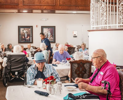 Residents enjoying a meal in a dining room