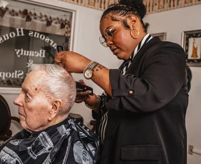Resident getting a haircut in the facility salon