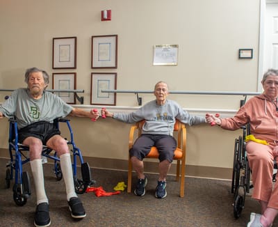 Residents participating in a group exercise activity