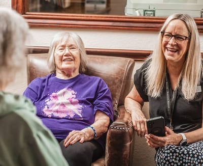 Residents and staff engaging in a conversation