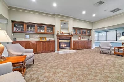 Interior common area with a fireplace and seating