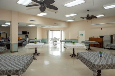 Common area with tables and decor for activities