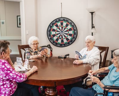Residents playing cards in a common area