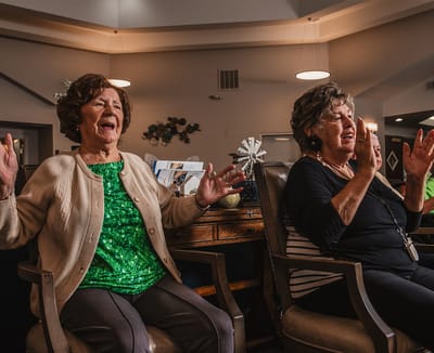 Two residents enjoying an activity in a communal area