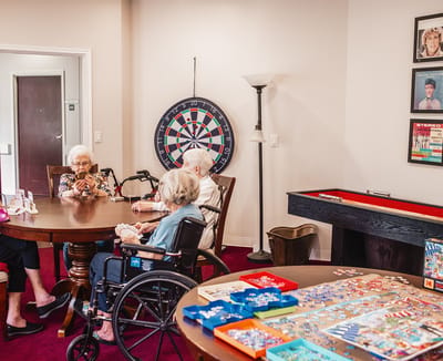 Residents enjoying a game in a common area