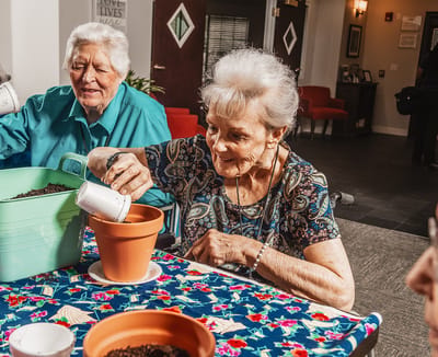 Residents engaging in a gardening activity indoors