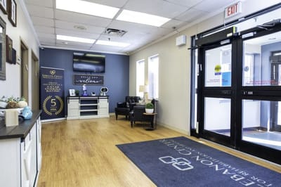 Interior lobby area with seating and welcome sign