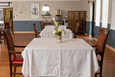 Dining area with tables and flower centerpieces