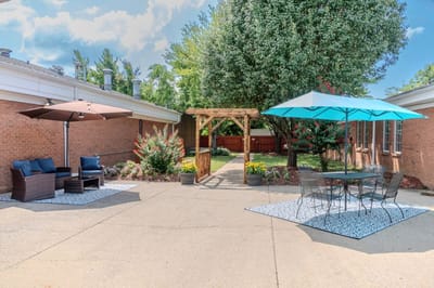 Outdoor patio area with seating and garden