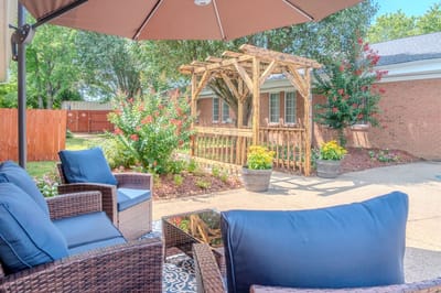 Seating area with outdoor decor and greenery