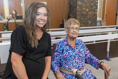 Staff member with a resident in a common area