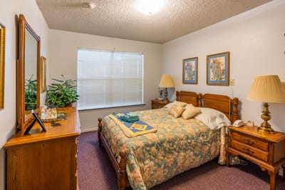 Cozy bedroom showing floral decor and warm lighting
