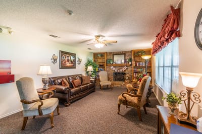 Cozy common area with seating and bookshelves