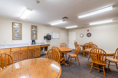 Common area with tables and chairs in a shared space