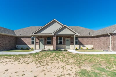 Exterior view of a senior living facility with a clear entrance