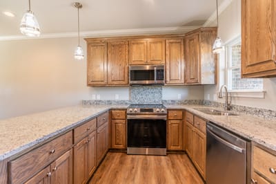 Modern kitchen with wooden cabinets and granite countertops