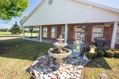 Garden area with a fountain and landscaped stones