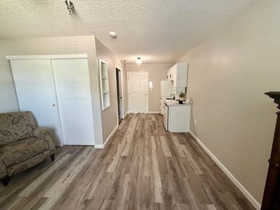Interior view of a small resident room with kitchenette