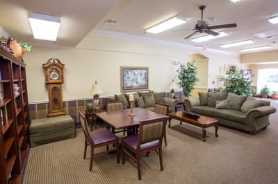 Cozy common area with seating and a clock