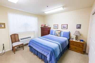 Cozy resident bedroom with a bed and furniture