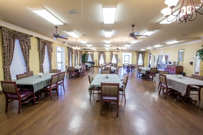 Dining room with tables and chairs arranged for meals