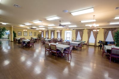 Dining room with tables and chairs set for meals