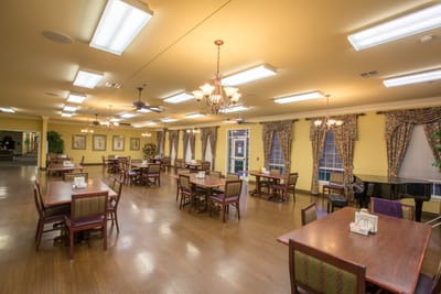 Dining room with tables set for residents