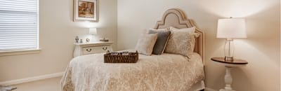 A well-decorated private resident room with light colors