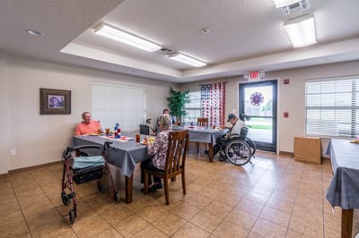 Residents enjoying a meal in a dining area