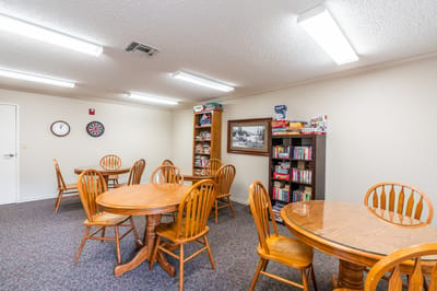 Common area with tables and games in a bright room