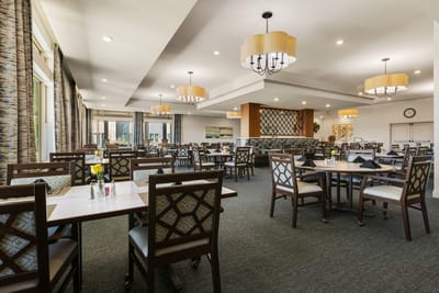 Interior dining room setup with tables and chairs