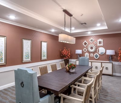 Bright dining room with a large table and decorations