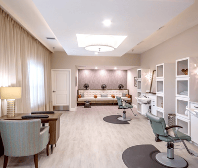 Beauty salon area with styling chairs and decor