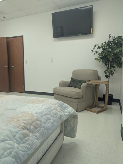 Cozy resident room with a chair and TV