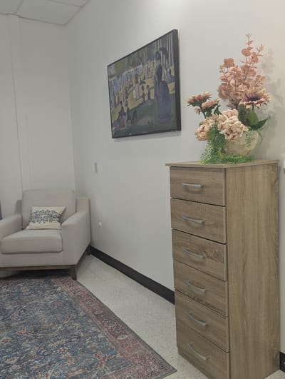 Cozy interior corner with a chair and decorative flowers