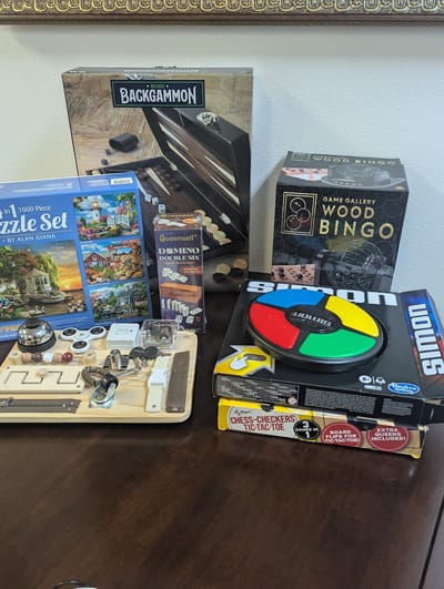 Various board games and puzzles on a table