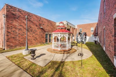 Outdoor courtyard with gazebo and landscaping