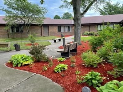 Garden area with benches and landscaped flower beds
