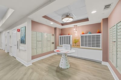 Interior view of a lobby with mailboxes and seating area