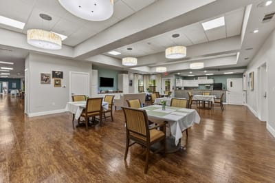 Spacious dining room with tables and chairs