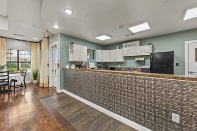 Bright interior of a shared kitchen area in the facility