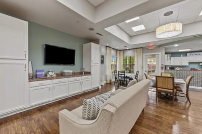 Bright common area with seating and dining setup