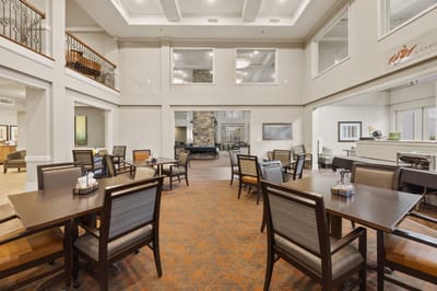 Bright interior view of a common area with tables and chairs