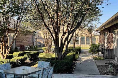 Outdoor garden area with pathways and seating