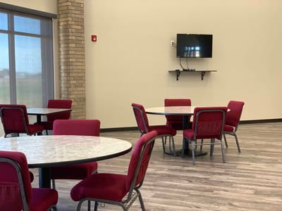 Inside view of a communal dining area with tables